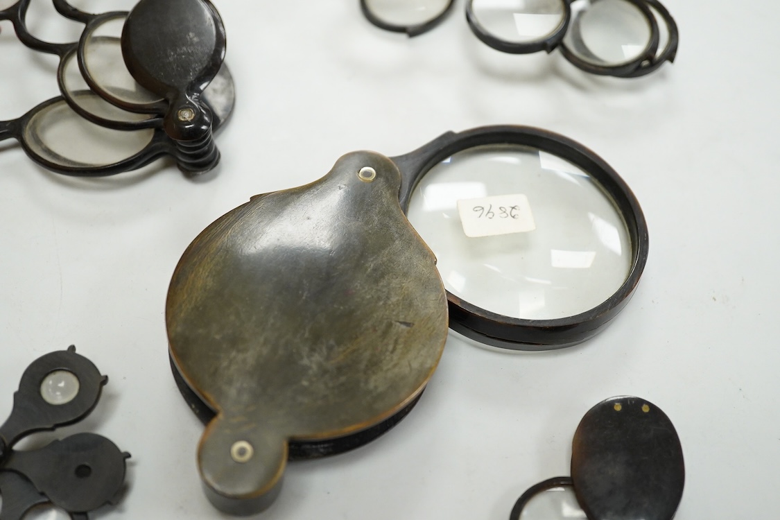 A group of 19th-century horn framed loupes, quizzing glasses and four optician multiple lens sizing lorgnettes (13)